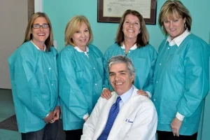 Dr. Eaves with members of his dental team